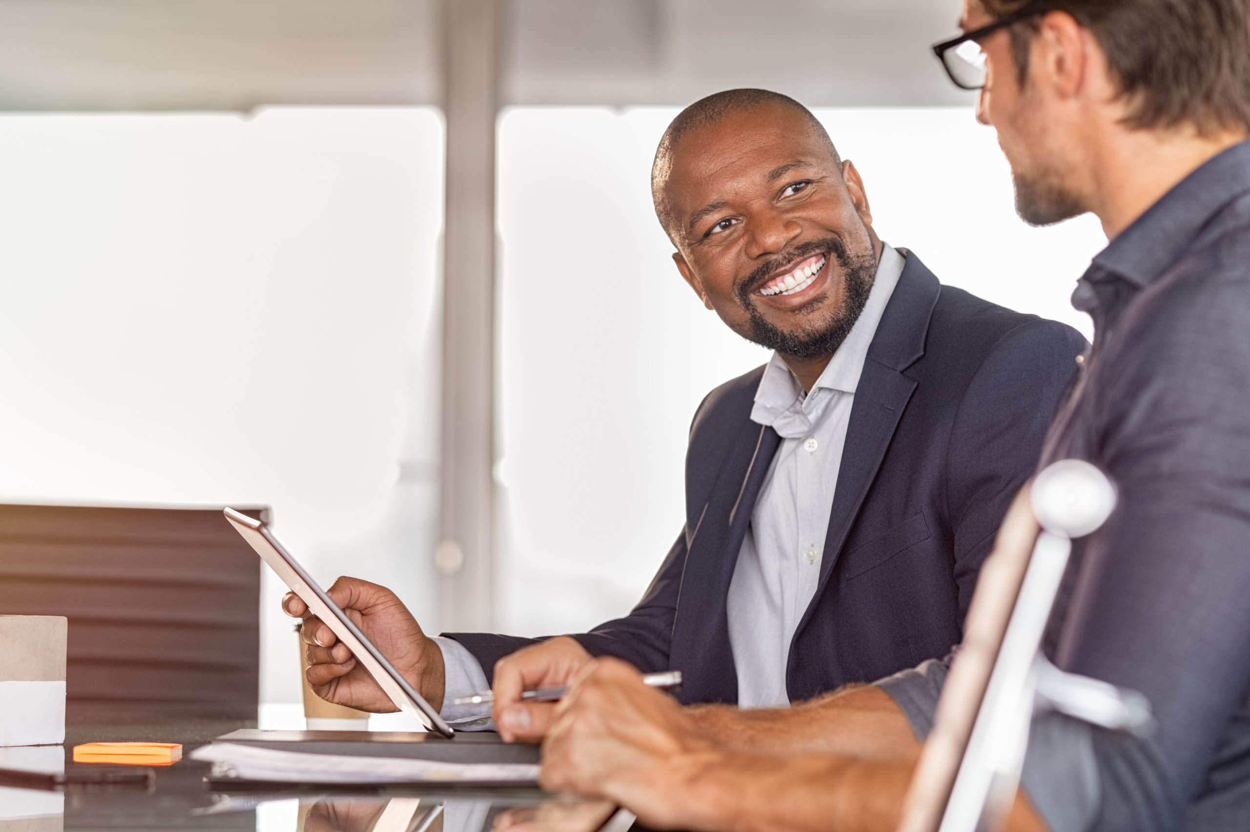 African businessmen in a conversation with colleague